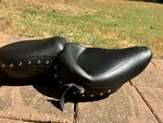 Mustang -standard Touring One-piece Studded Seat, Smooth Black. Fixed Price $375.00.