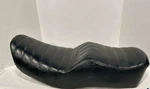 Travelcade Motorcycle Seat With Black Vinyl Cover. Fixed Price $58.95.